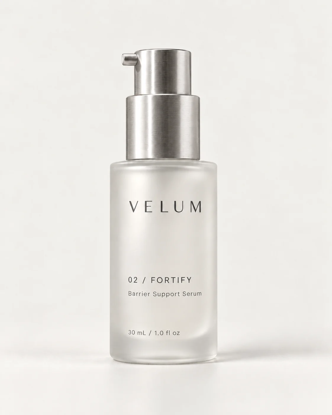 VELUM FORTIFY frosted glass serum bottle with a brushed aluminum treatment pump