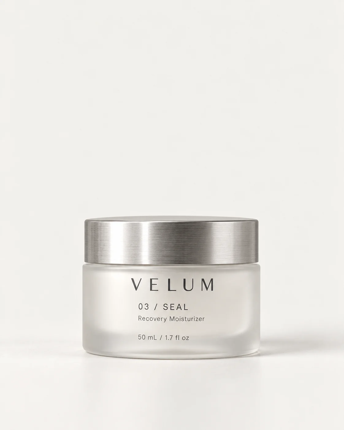 VELUM SEAL low-profile frosted glass moisturizer jar with a brushed aluminum lid