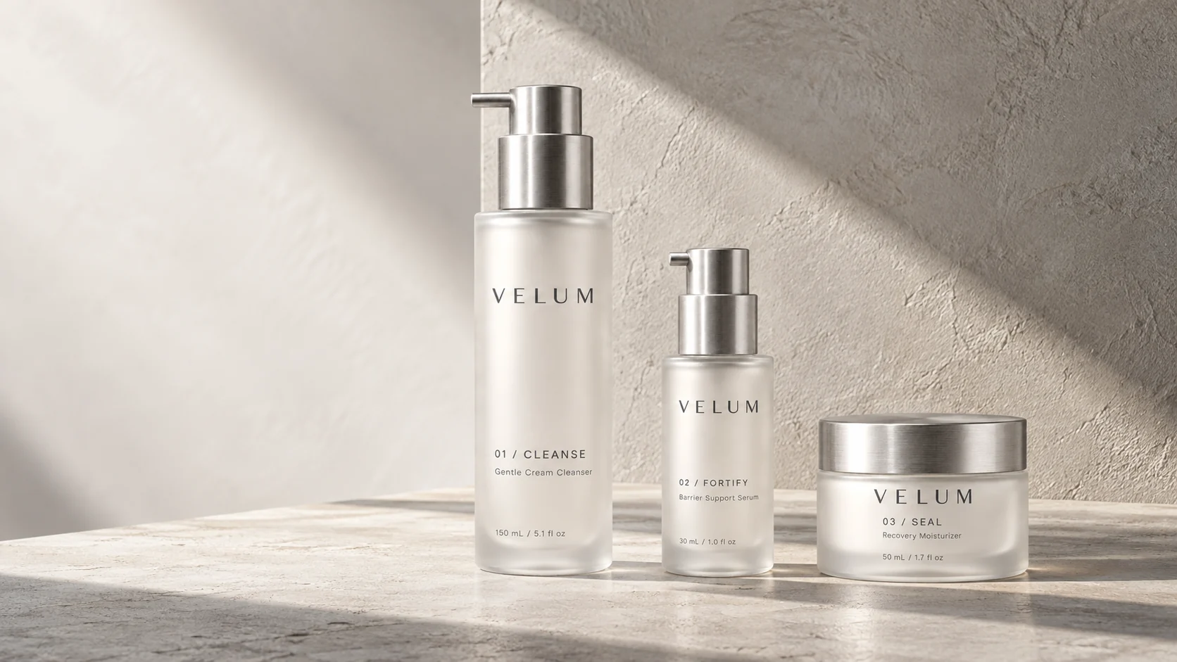 The complete VELUM collection: CLEANSE, FORTIFY, and SEAL arranged on pale stone
